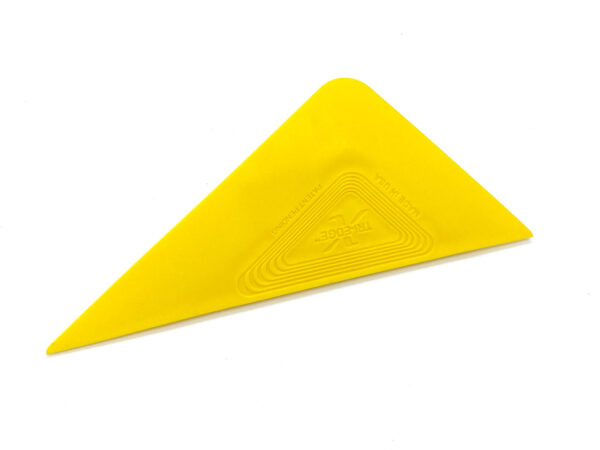A yellow triangle shaped object with a cross on it.