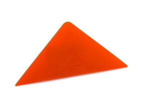 A red triangle is sitting on the floor