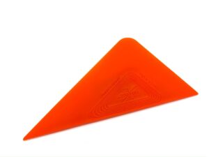 A red triangle is sitting on top of the floor.