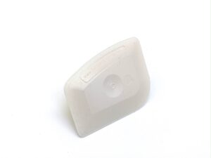 A white plastic container sitting on top of a table.