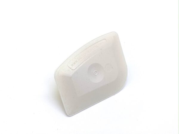 A white plastic container sitting on top of a table.