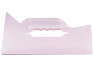A pink plastic handle with a white background