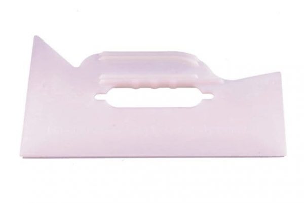 A pink plastic handle with a white background