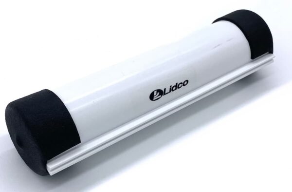 A white and black object is sitting on the floor